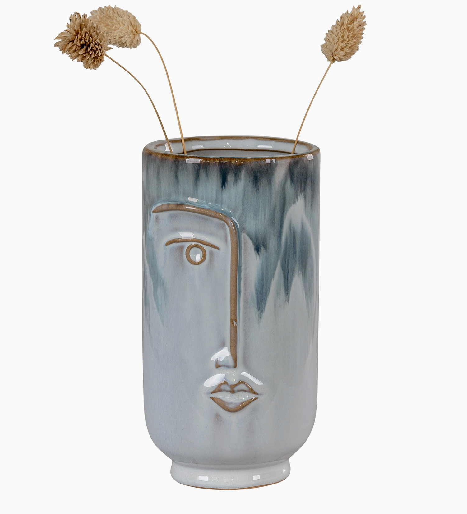 Vase visage avec fleurs séchées sur une console